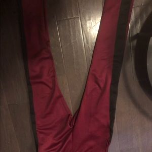 Burgundy with the black stripe track pants